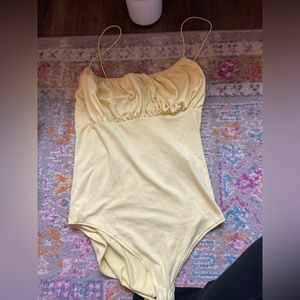 Yellow bodysuit